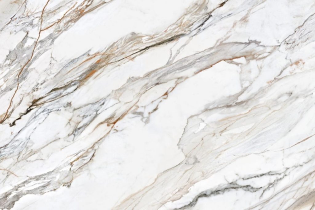 Pattern of natural Italian Calacatta quartz slab with unique veining, compared to engineered stone.
