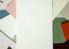 Vibrant arrangement of colored paper shades on a flat surface, ideal for design projects.