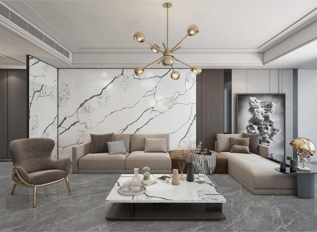 a living room with a marble wall and a couch all by black branches quartz stone